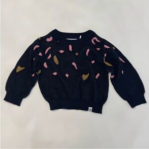 Stylish Navy Sweater with Pink and Gold Accents